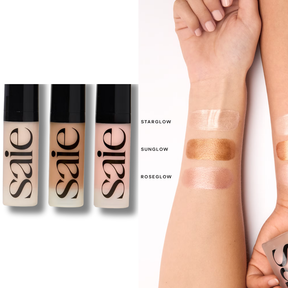 Three saie foundation bottles with swatches on a white background. saie Glowy Super Gel Mini Trio with packaging on a white background. SAIE Mini Glowy Super Gel Trio 15ml x3